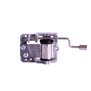 Manual hand-crank music box movement in silver metal for DIY musical crafts