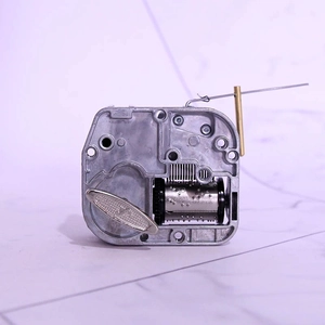 Mechanical wind-up music box movement DIY part with metal cylinder and butterfly key