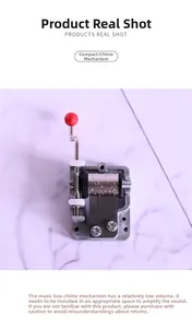 Mini mechanical music box movement DIY part with hand crank and red knob detail