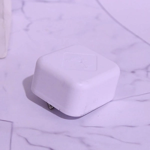 White 18-note mechanical music box movement in a square plastic shell for DIY projects