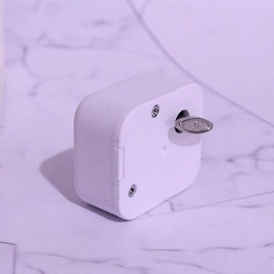 Mechanical 18-note white music box movement with silver winding key and square casing