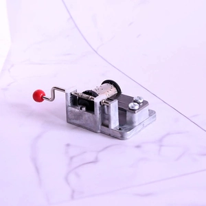 Mini hand-cranked DIY musical box movement with red knob and zinc alloy mechanism