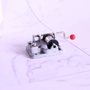 Mini DIY hand crank music box movement with vintage metal base and red ball handle