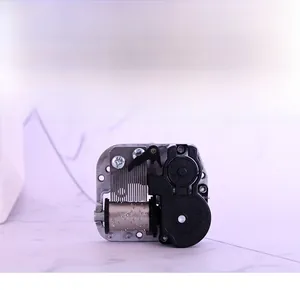 Detailed macro view of 18-note mechanical music box movement with gear mechanism
