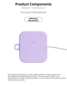 Macro view of mini mechanical music box component with purple shell and pull string