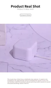 Macro view of white plastic mini pull-string music box movement for DIY craft decorations