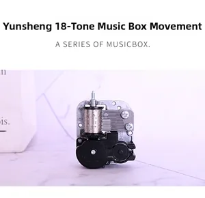 Detail of 18-note mechanical music box movement with silver spindle and black base