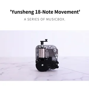 Close-up of an 18-note mechanical music box movement with metal gears and black base