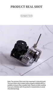 Mechanical wind-up music box movement part with silver metal base and cylinder components