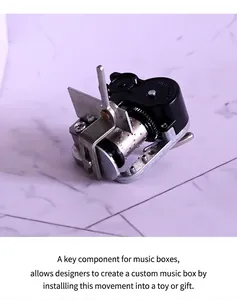Macro shot of mechanical music box movement with metal cylinder and black protective case