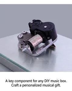 Top view of a Yunsheng mechanical music box movement for DIY toys on marble background