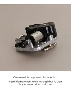Detailed macro view of the mechanical zinc alloy music box movement with gears