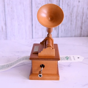 Vintage phonograph style wooden music box with DIY paper strip and hand crank