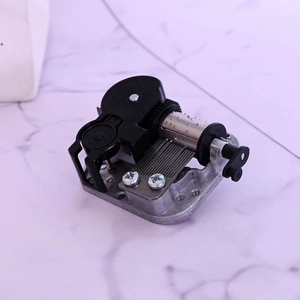 Mechanical 18-note DIY music box movement with metal base and black plastic key