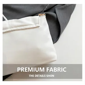 Close-up of white bow bag showing premium quilted PU leather and gold metal ring detail