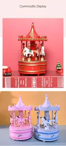 Macro detail of vintage wooden carousel music box with hand-painted horses and gold trim