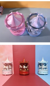 Detailed top and side views of colorful carousel music boxes with embossed base patterns