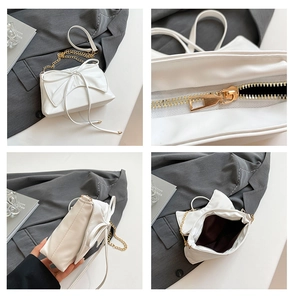Detail views of white bow tote showing gold chain strap, zipper, and interior capacity