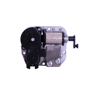 Mechanical DIY music box movement mechanism with silver metal cylinder and black crank handle