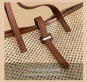 Close-up of premium silver hardware and brown faux leather handle on a straw woven tote bag