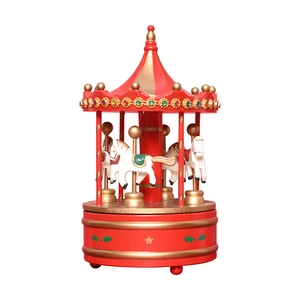 Classic red and gold carousel music box with white horses and festive holiday ornaments