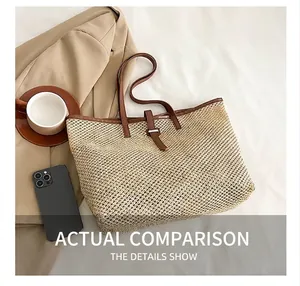 Top view of beige woven tote bag with brown leather handles and casual office accessories