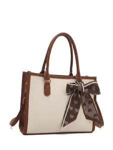 Women's cream tote bag with ribbon bow and product size chart measurements