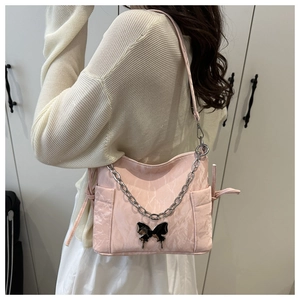 Pink underarm bag with marble texture, butterfly detail and silver chain strap