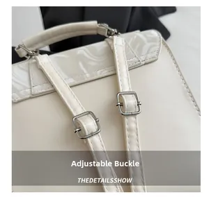 Detail showing the adjustable silver metal buckle and premium stitching on the shoulder strap