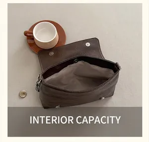 Top view of the deep brown leather bag showing spacious interior and magnetic snap closure
