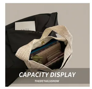 Detail shot of the beige woven tote bag interior showing spacious capacity for daily items