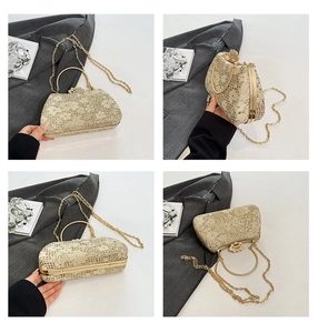 Macro detail of champagne gold crown clutch with sequined lace and metal handle