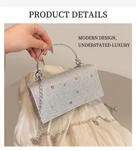 Close-up of sparkling silver rhinestone evening bag with circular metal handle detail