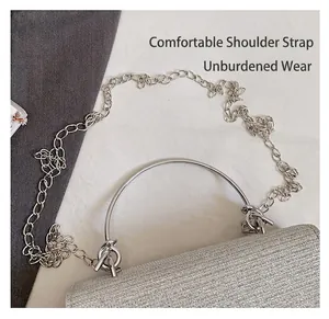 Detail view of the silver glitter evening bag with metal chain strap and round handle