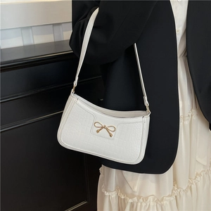 Elegant white crocodile texture underarm bag with a golden bow metal accent