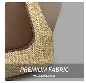 Close-up of contrast stitching and mixed textures on the straw and leather tote bag