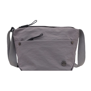 Minimalist grey nylon crossbody bag with wide shoulder strap and metal logo