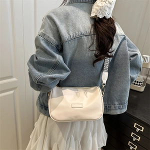White vintage pillow bag with FASHION label and black-white checkered strap for women