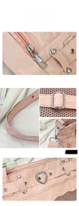 Detailed view of pink textured leather Ita bag with heart rivets and silver metal hardware