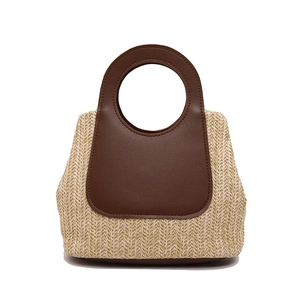 Minimalist straw tote bag with V-shaped weave and contrast brown leather handle