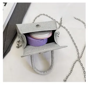 Close-up of silver glitter bag interior with chain strap showing storage capacity