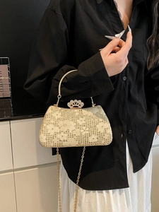Elegant champagne gold crown evening bag with lace fabric and shimmering rhinestones