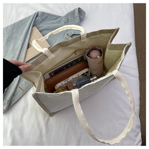 Spacious tote bag interior showing large capacity for tablet, umbrella and cosmetics