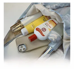 Top view of large capacity canvas tote bag interior showing daily personal care items