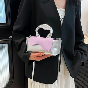 Silver metallic mini crossbody bag with lilac wavy flap and unique sculptural handle
