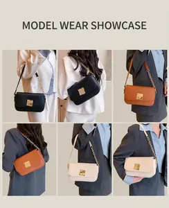 Detail view of stylish square shoulder bags in black, brown, and cream with gold buckles