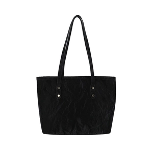Large black tote bag with ruched texture, dual shoulder straps and metallic hardware