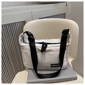 Minimalist white canvas shoulder bag with black adjustable strap and Fashion label