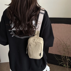 Japanese style beige nylon mini crossbody sports bag for outdoor activities in 2025
