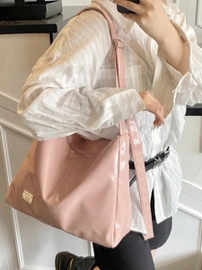 Pink glossy faux leather tote bag with large capacity and gold logo plate for women